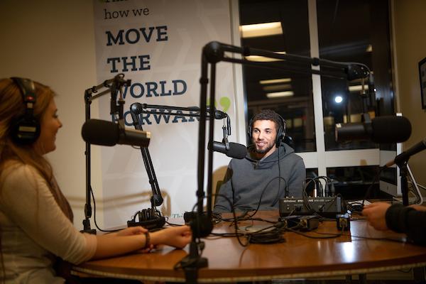 Two students recording in the podcast studio.