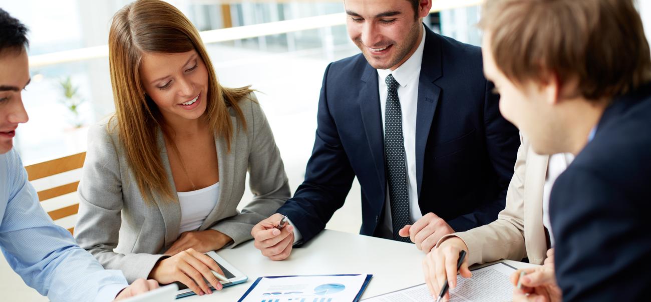 Marketing professionals go over information at a meeting