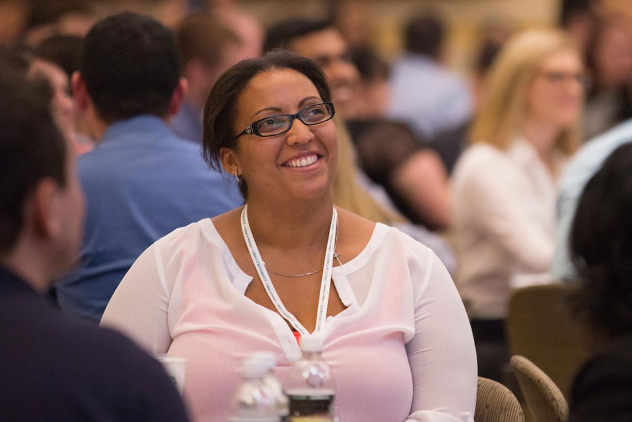 Woman at conference smiling