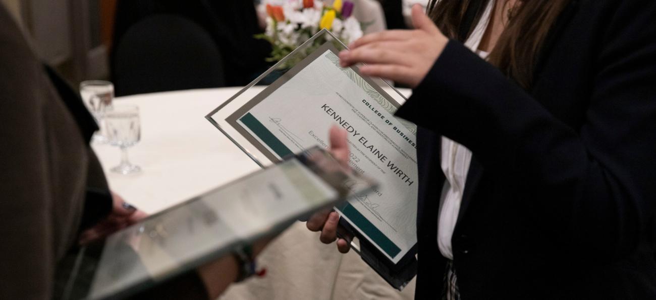 Students receive plaques at Executive Advisory Board award ceremony