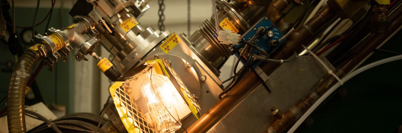 Neutron production in the Edwards Accelerator Laboratory includes via solid and gaseous tritium targets