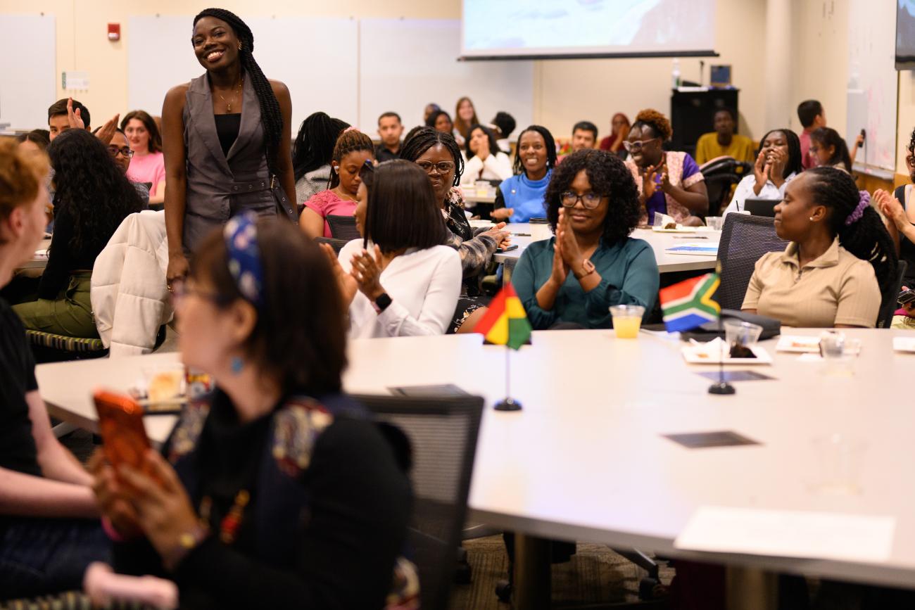 A room full of happy students celebrating achievements.