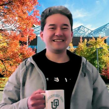Jesus Toapanta with an Ohio University mug