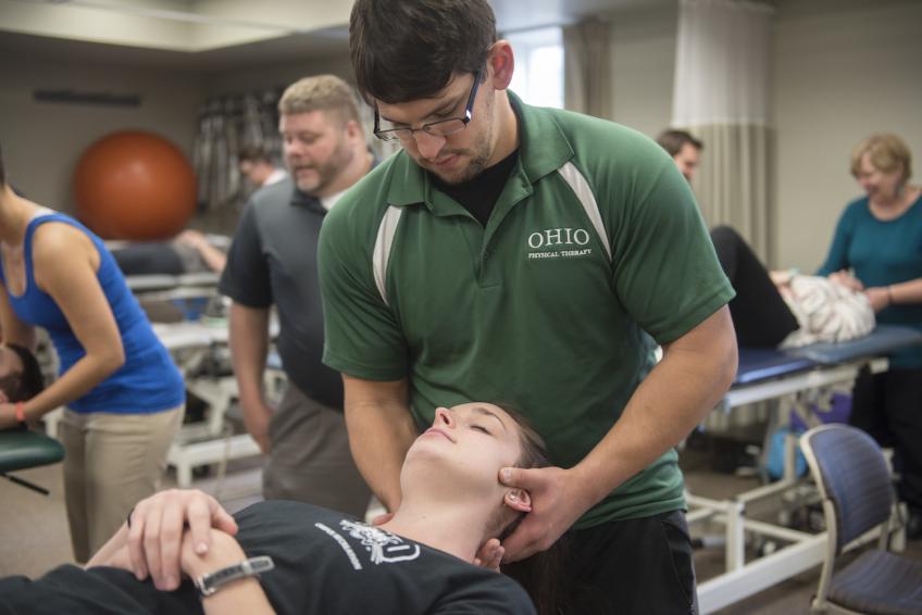 students practicing physical therapy techniques