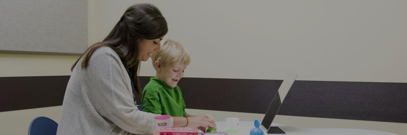 Communication Sciences Student working with a child