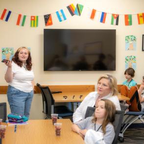 Teacher pointing to something in classroom