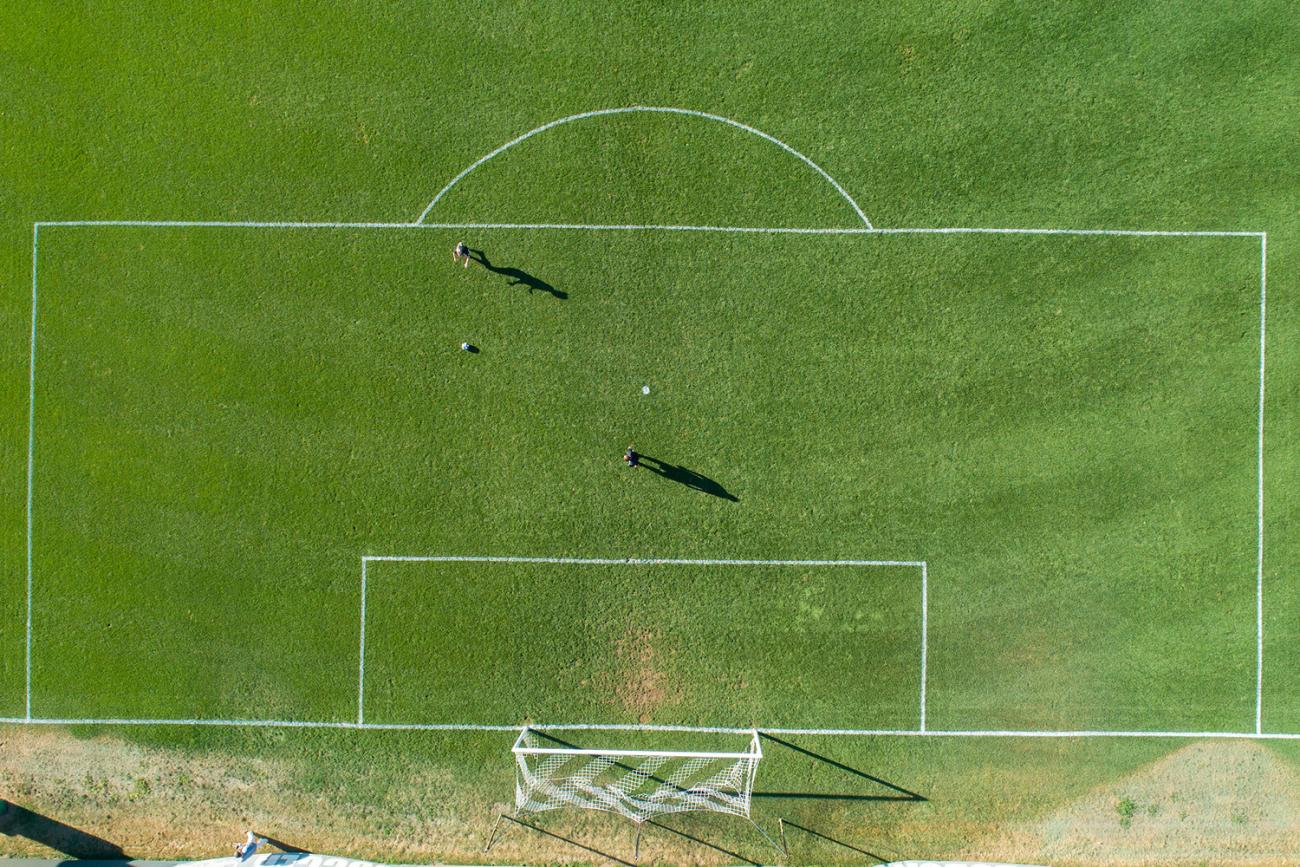 Aerial photo of half of a soccer field and penalty box