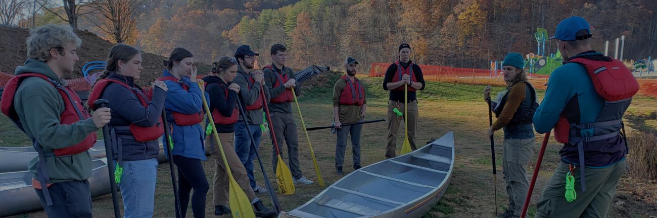 Robe Leadership Institute students prepare for a canoe trip.