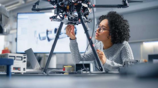 Female engineer in lab working on an electronic navigation system