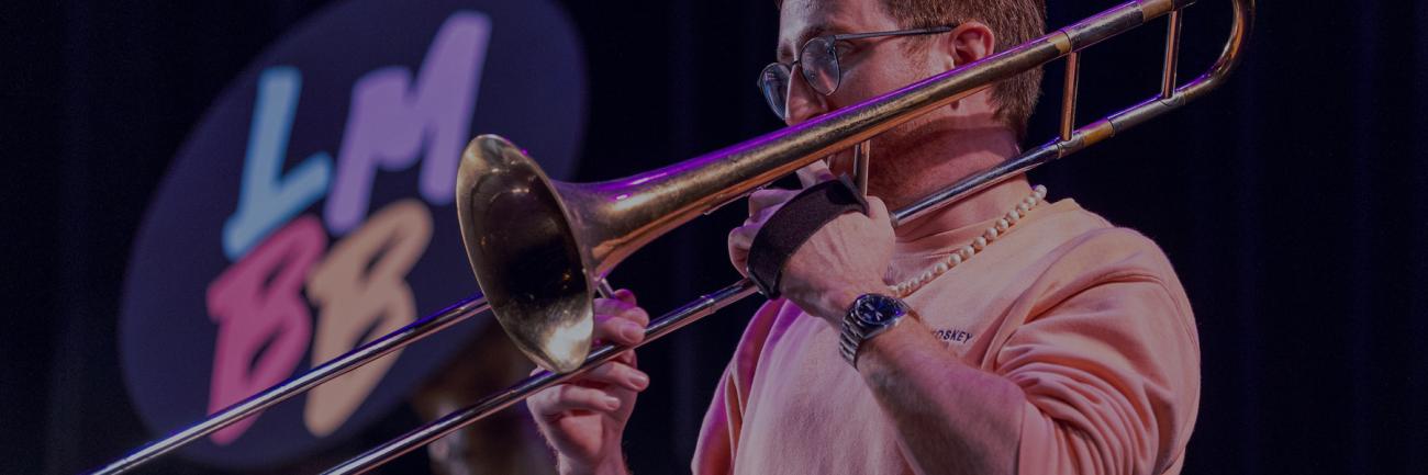 A student playing a trombone