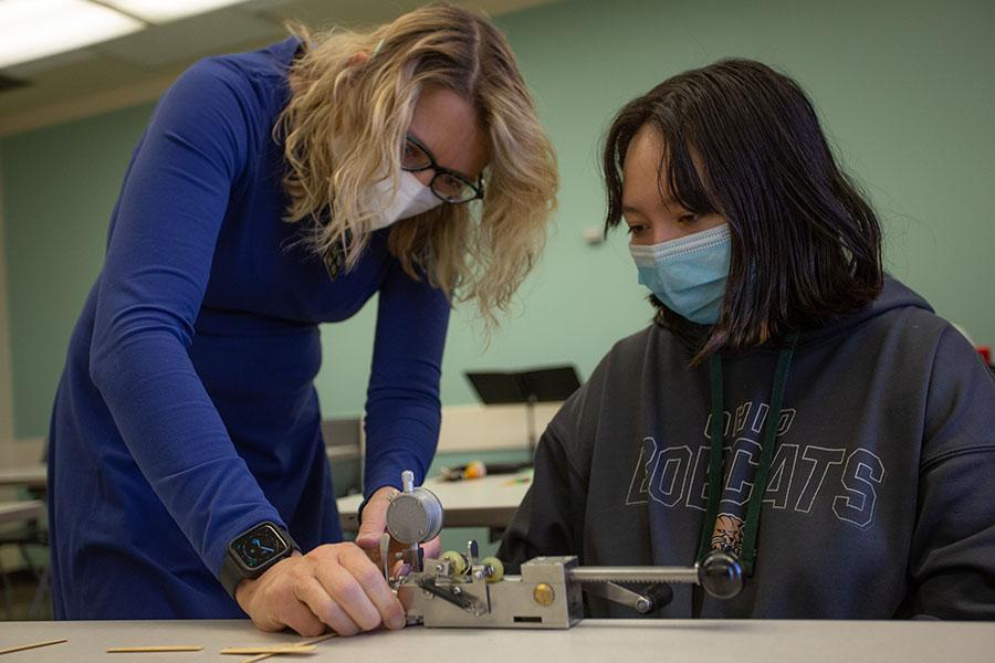 Faculty helping student.