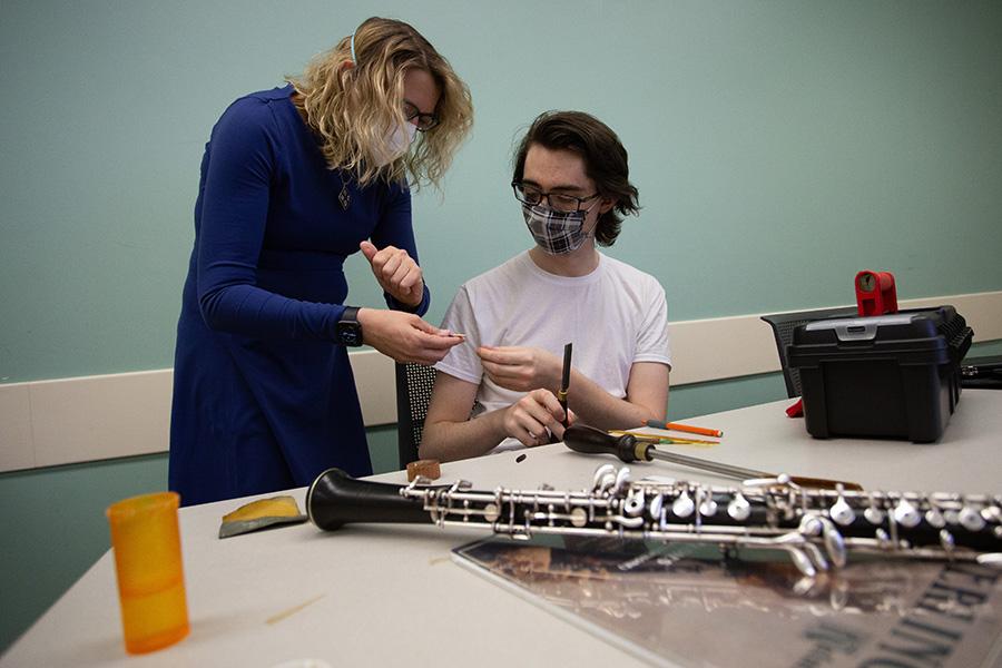 Student learning to make a reed