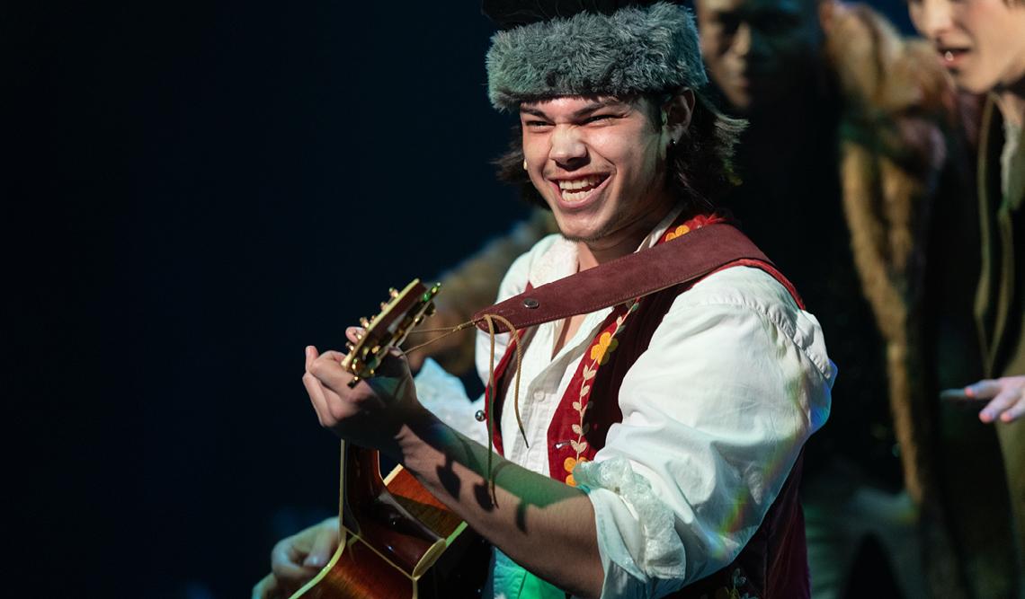 Person playing guitar