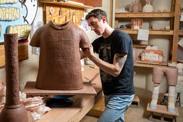Ceramics student in studio