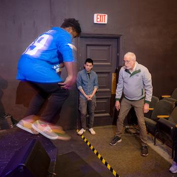 Students and faculty working on a production