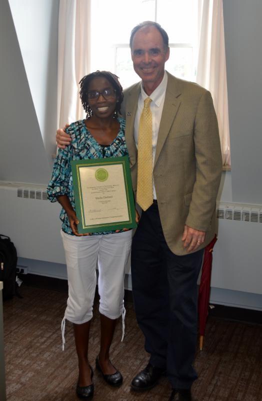 Shelia Chelimo holding award