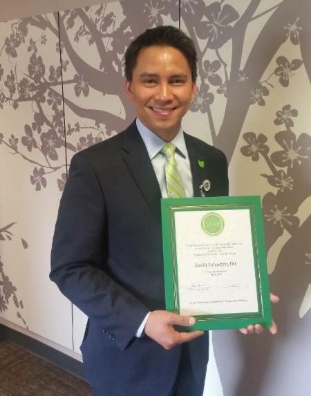 David Tolentino holding award