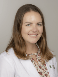 head shot of student wearing their white coat