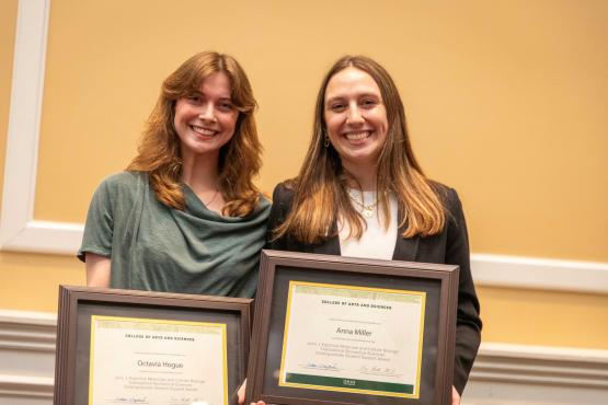 Two undergraduate awardees holding certificates