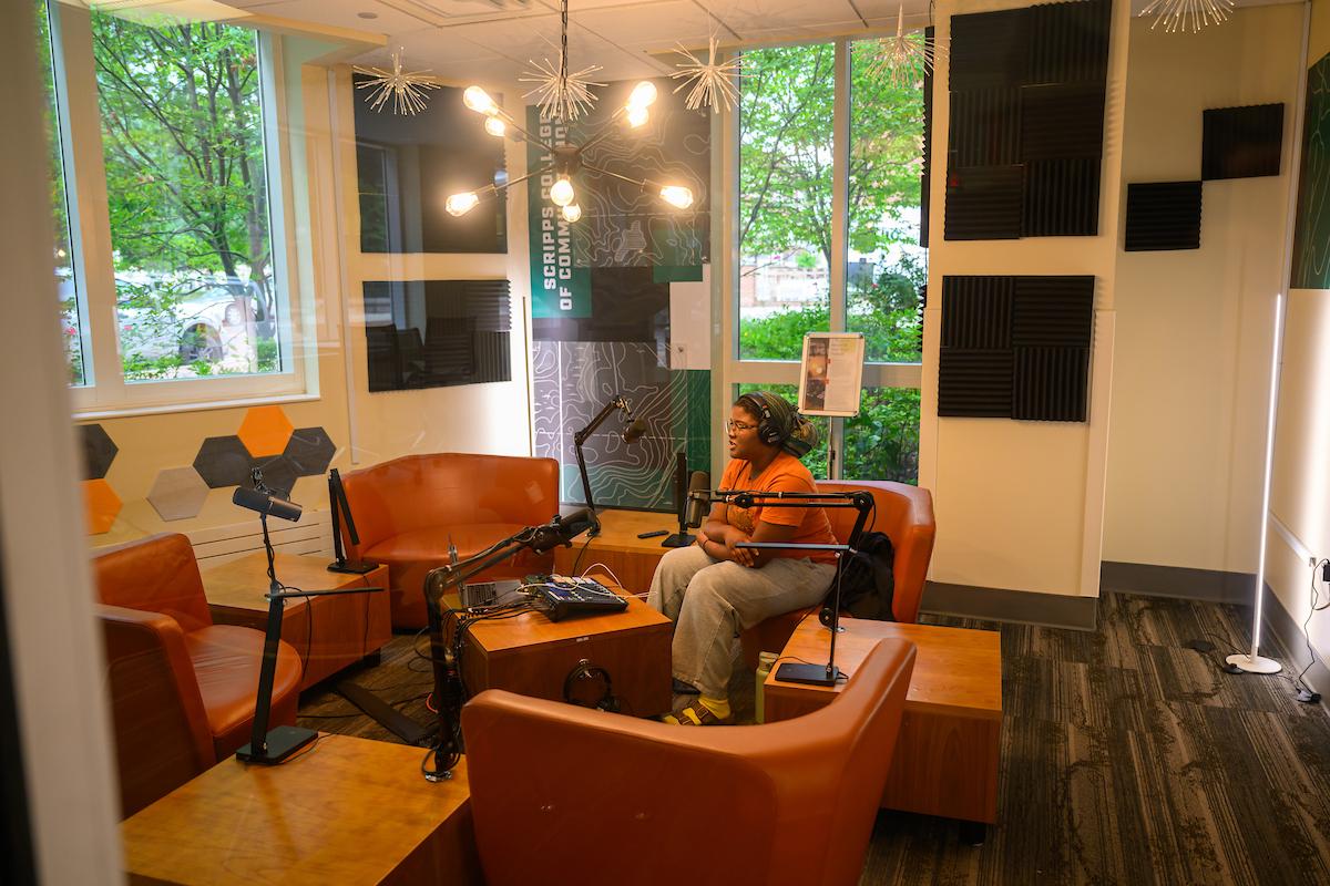 Student records podcast in studio