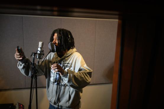 man recording vocals in the studio