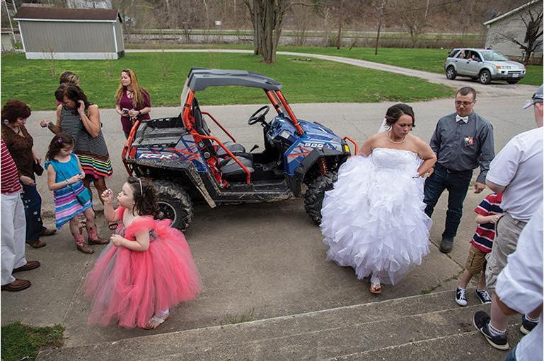 Photo of a bride and a jeep by Haiyun Jiang