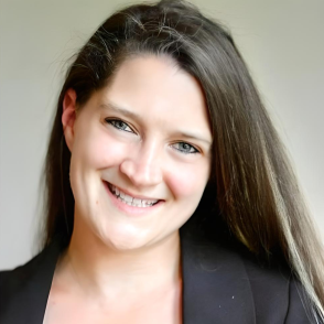 Headshot of woman smiling with long hair