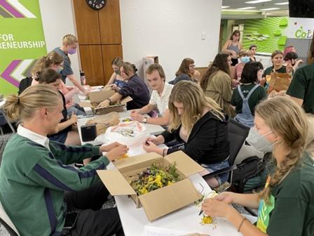 Members of Bobcats Go Green make sustainable confetti