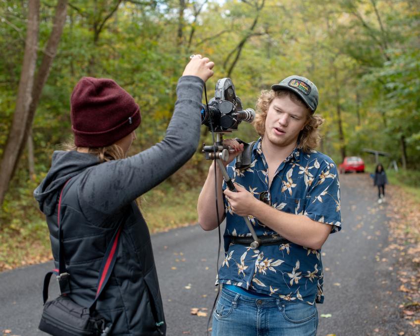 Two students set up a camera