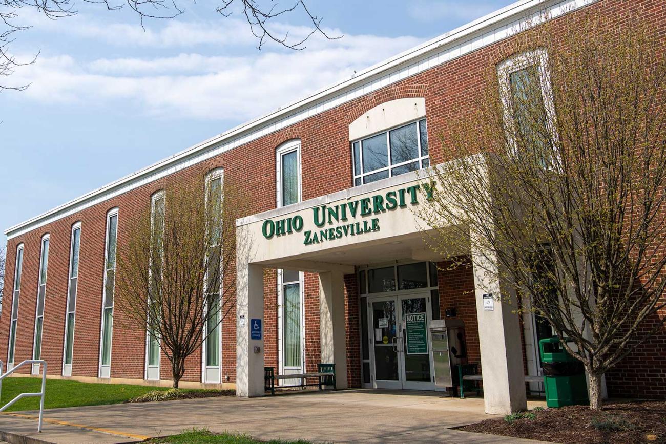 Shot of the front of a campus building on Zanesville campus, brick with white pillars