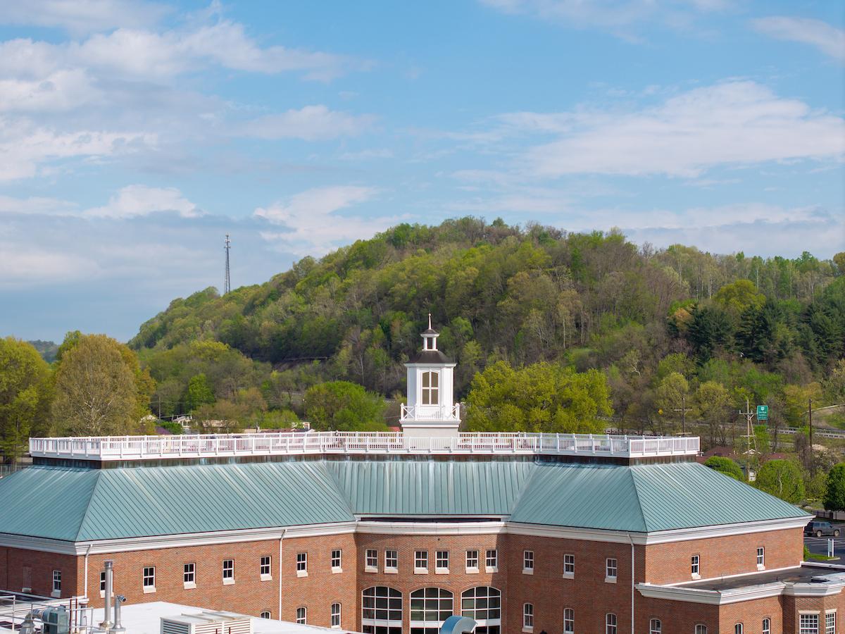 View of Riffe building with woods in background