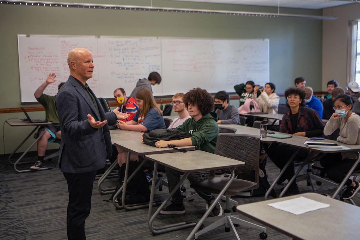 Lonnie Welch teaching a classroom full of college students