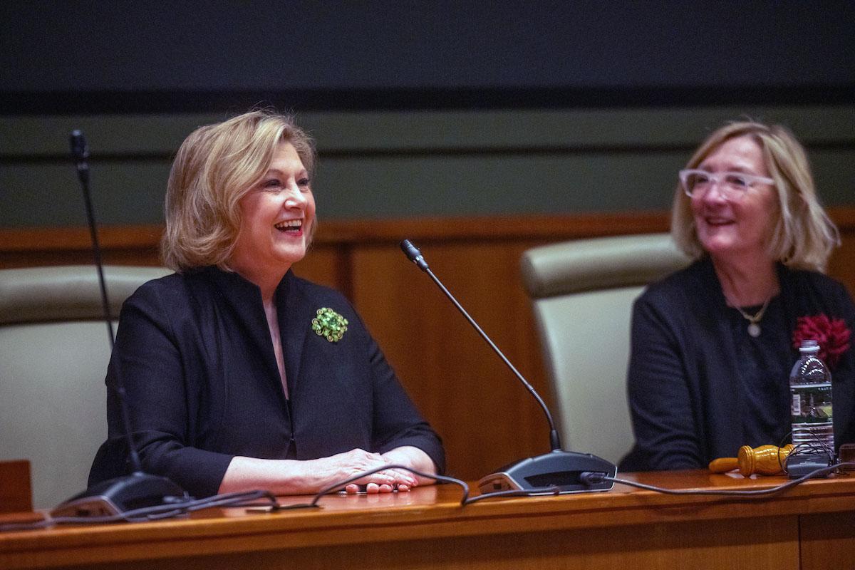 President Lori Stewart Gonzalez smiles as she sits in the board room.