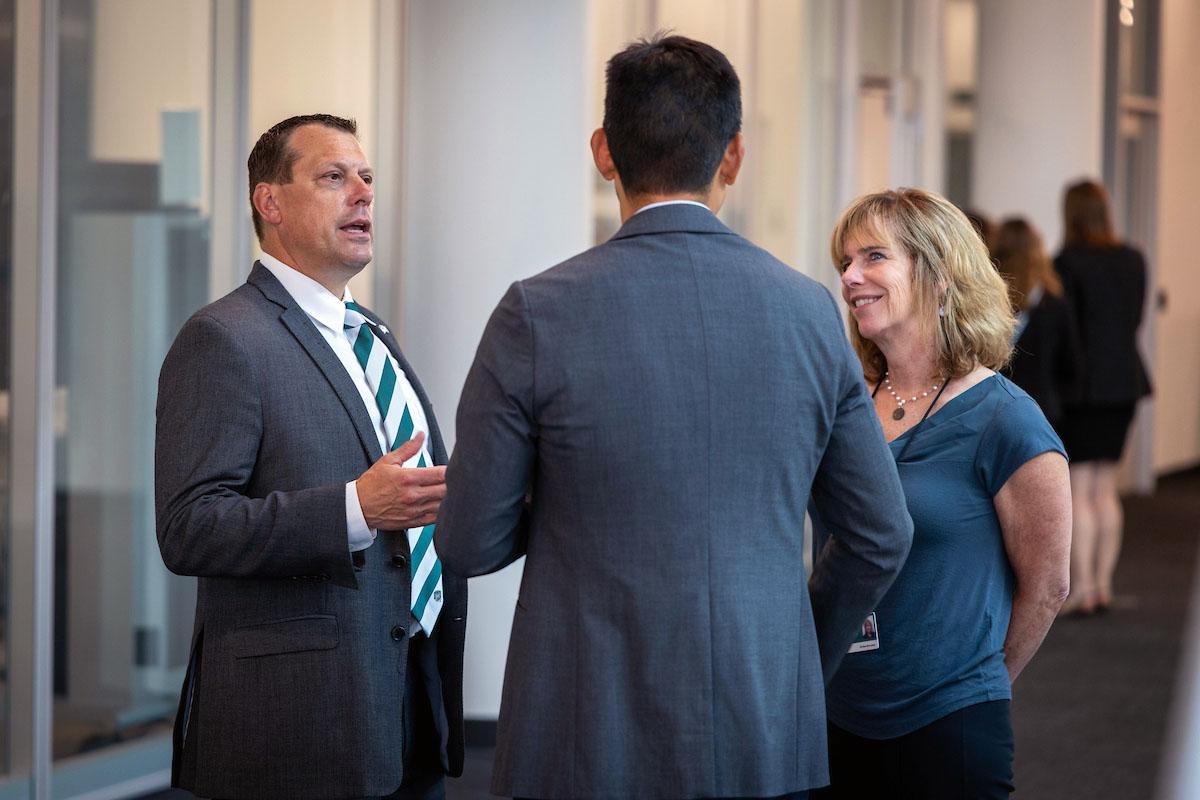 Eric Muth speaking to people at the 2024 Summer Research Symposium