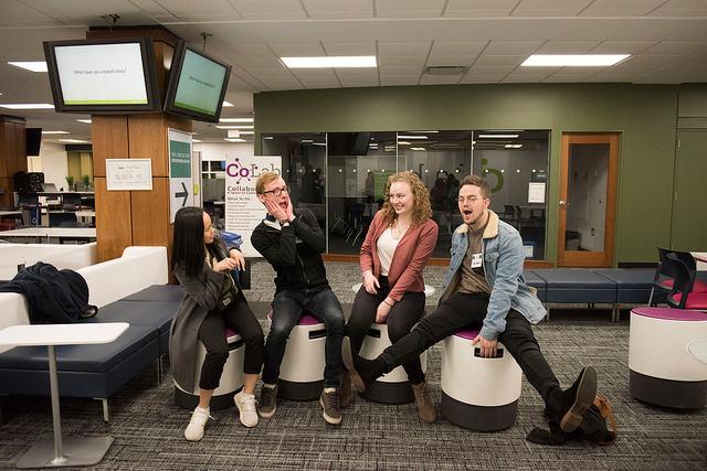 Students sitting on the buoy chairs in CoLab