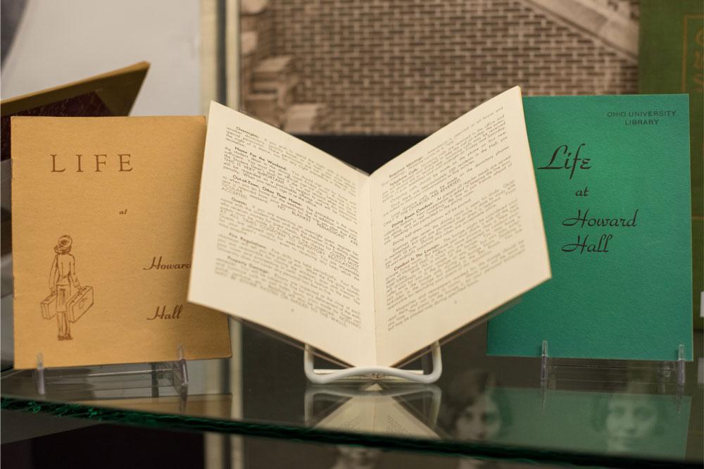 Residence Hall manuals, such as those pictured above from Howard Hall, informed residents of policies and expectations of living on campus.