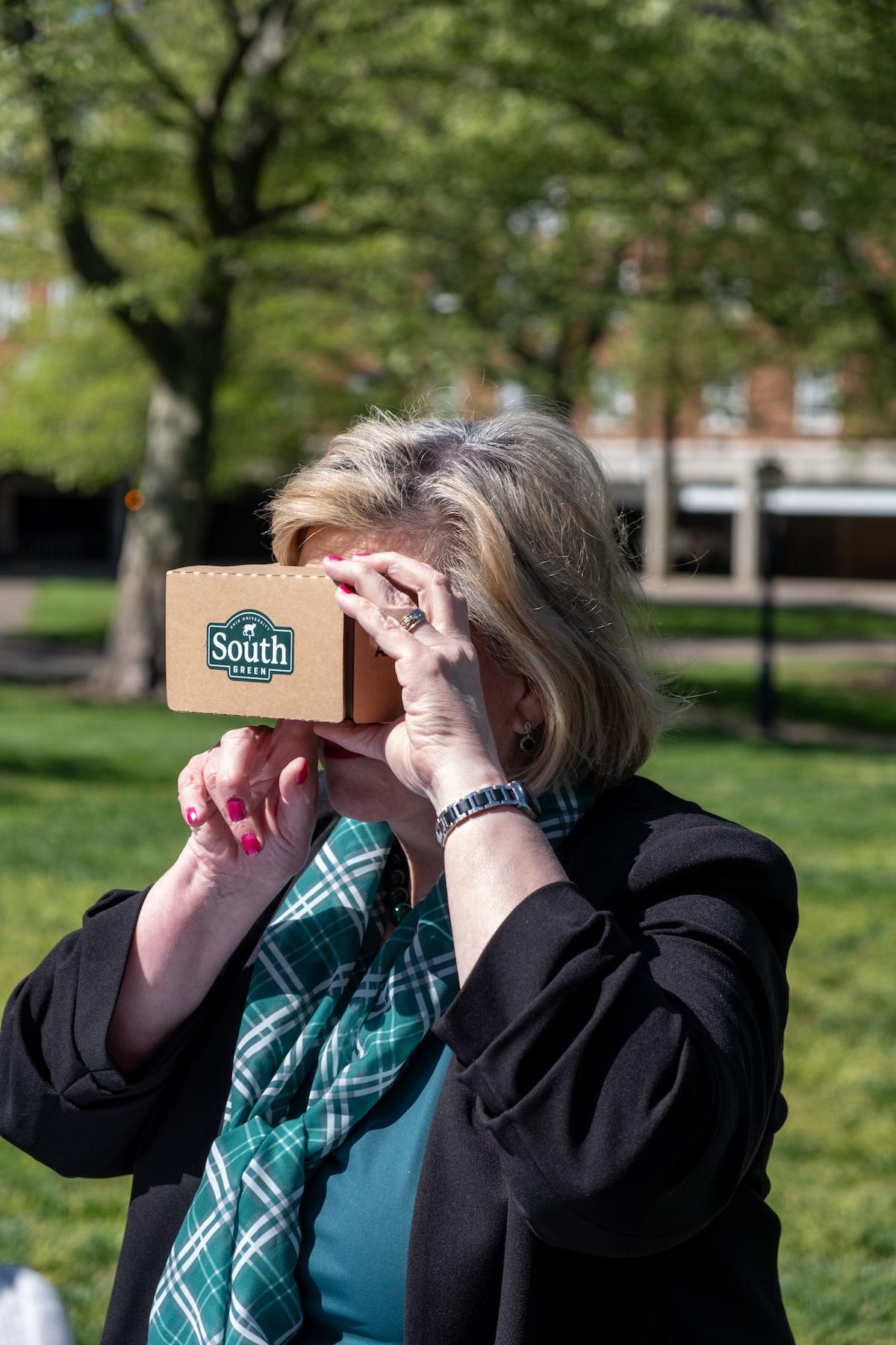 President Gonzalez looking through Google view finder