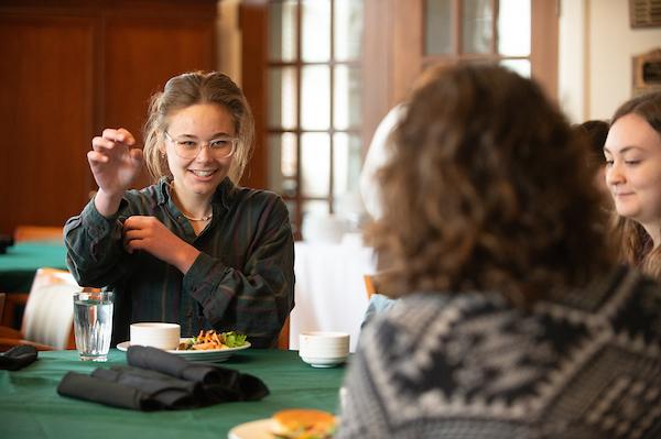 Students having a meal together at a table