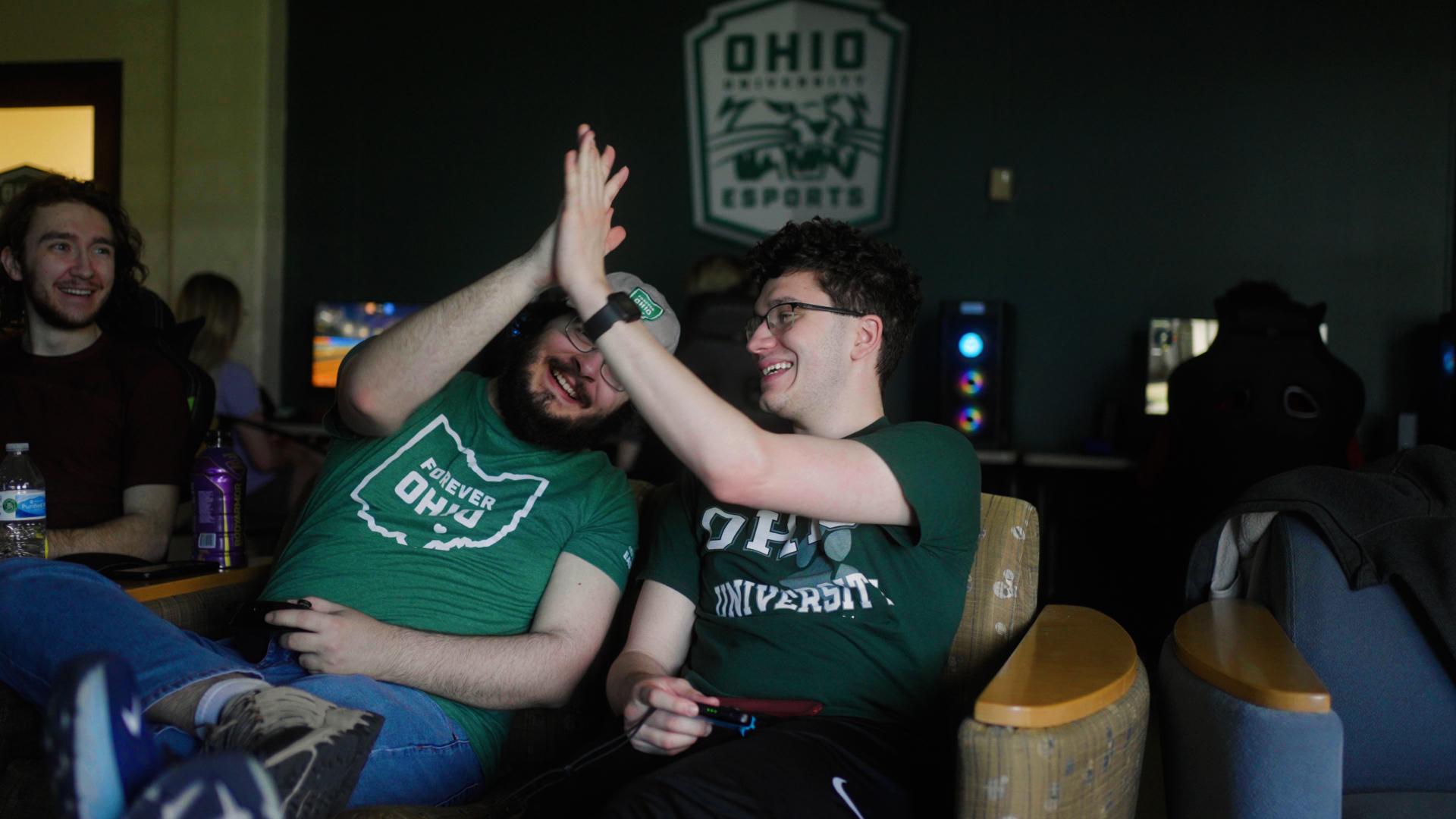 Esports students high five