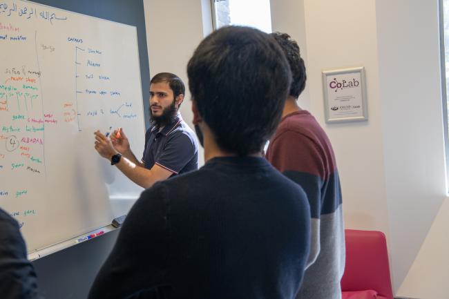 People at a white board