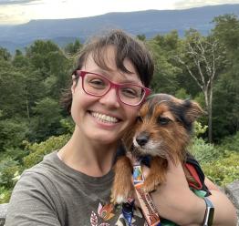 Brittany Swansboro with dog on top of a hill/mountain
